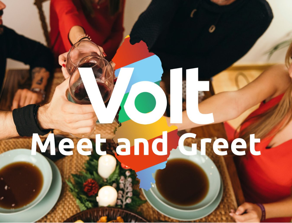 A group of people clinking glasses in a toast over a table set with plates and festive decor. The words “Volt Meet and Greet” are displayed in large white text over an outline of Kosovo in Volt’s colors (blue, green, yellow, red). The image conveys a friendly and celebratory atmosphere, symbolizing a welcoming community gathering.